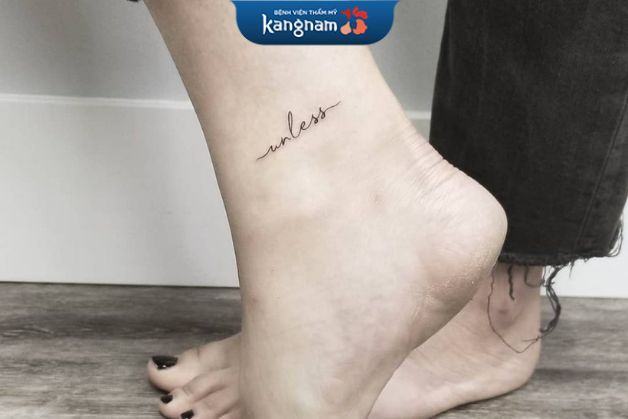 Hình xăm chữ "Unless" trên cổ chân cho nữ
