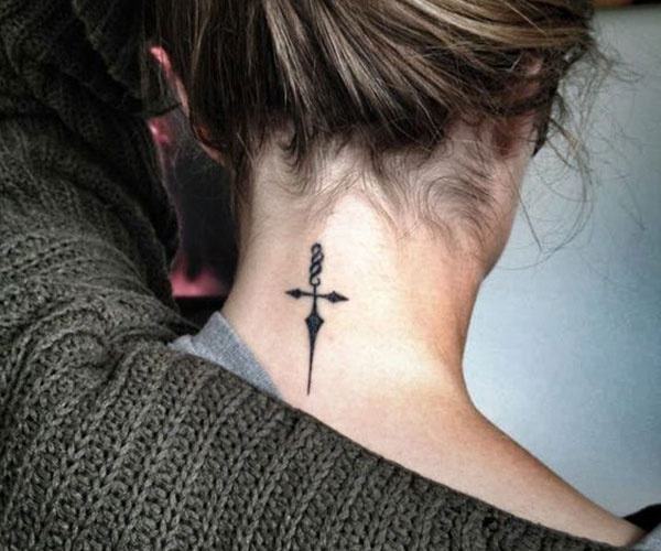 unique tattoo of the cross on the back of the neck