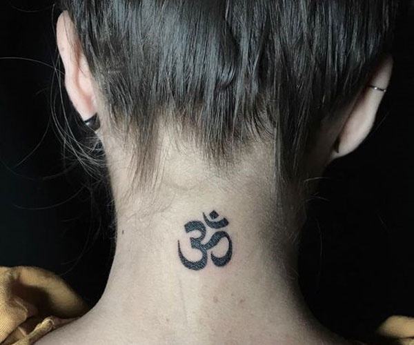 beautiful om tattoo on the back of the neck