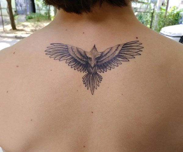 Unique eagle tattoo on the back of the neck