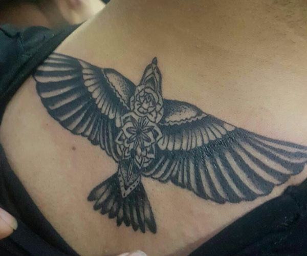 beautiful eagle tattoo on the back of the neck