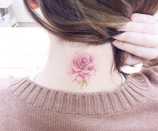 beautiful rose tattoo on the back of the neck