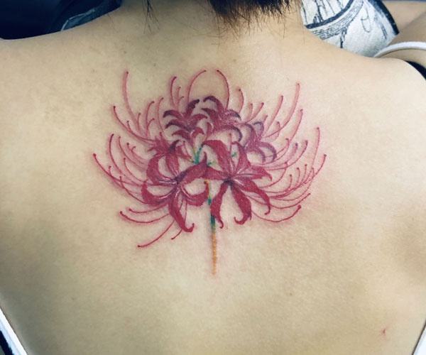 Unique flower tattoo on the back of the neck