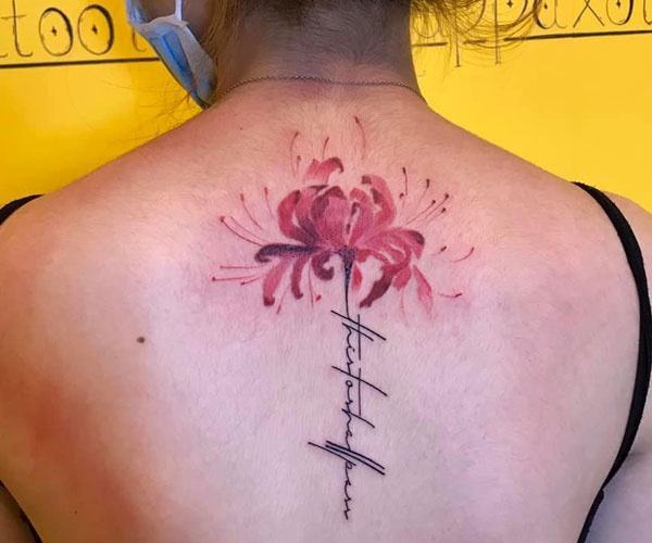 Beautiful flower tattoo on the back of the neck
