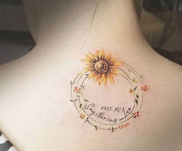 pretty sunflower tattoo on the back of the neck