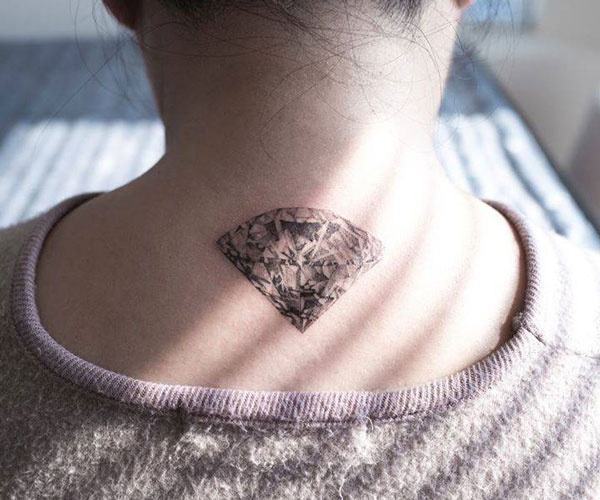 beautiful diamond tattoo on the back of the neck
