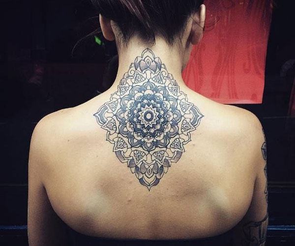 Unique pattern tattoo on the back of the neck