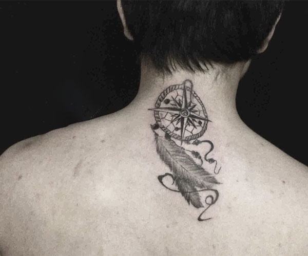 Compass tattoo on the back of the neck
