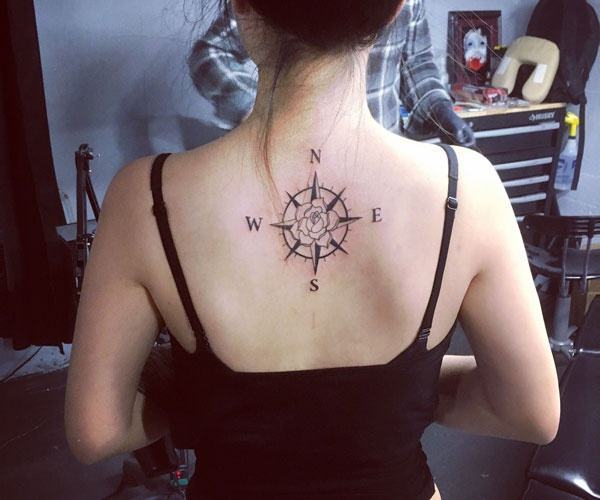 Compass tattoo on back of neck 
